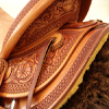 Half Breed Wade Saddle by Keith Valley Specs: Wade tree by Rick Reed 16 inch seat Gullet - 7 & 1/2H by 6 & 1/4W by 4 94 Degree Bars Horn - 3 & 5/8ths high by 4 & 1/2 Guatelajara Cantle - 4&1/2 inches high by 12&1/2 inches wide Cheyenne Roll - 1 & 3/4 inches 7/8ths flat plate riggin, Vaquero Geometric Border with Sheridan Style Floral Stainless Steel Hardware - by Harwood 4&1/2 inch Monel Stirrups Santa Barbara twisted stirrup leathers Full length stirrup leathers 32 inch 100% Mohair Roper Cinch 7 foot latigos - both sides Ready to ride and go to work.